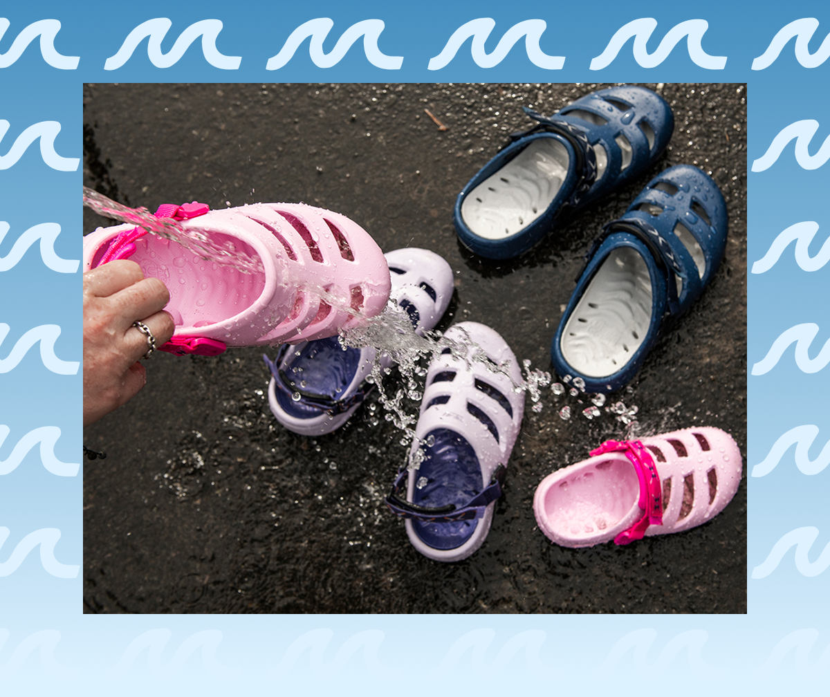 Apre-Aqua sandals being rinsed out in the water.