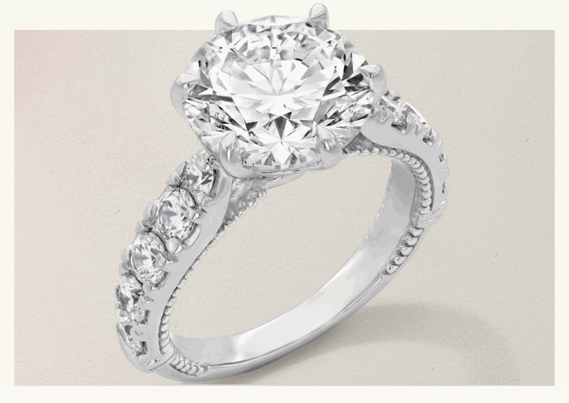Thick silver-set diamond eternity band, with circle-cut diamond placed on center with 6 prongs.