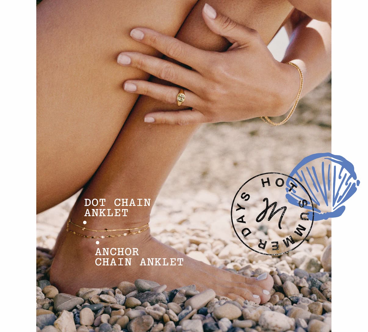 Close-up of a woman's leg on a pebble beach wearing the Dot Chain Anklet and Anchor Chain Anklet by Mejuri.