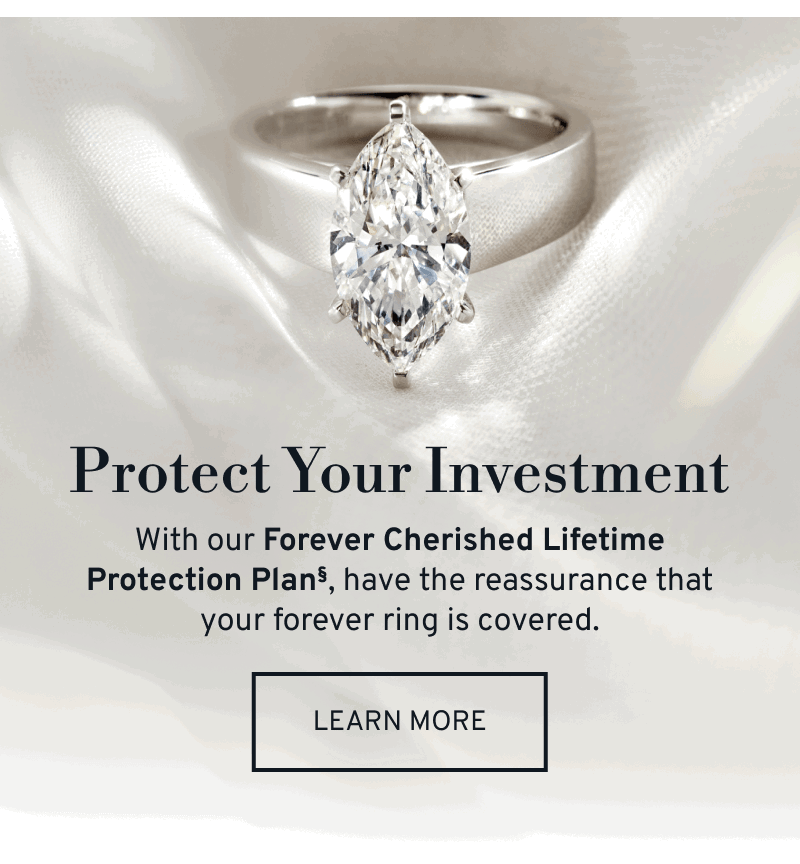 Engagement ring sitting on white silk. Discover our Forever Lifetime Protection Plan for your ring. Click to Learn More