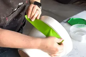 Put a piece of tape on a terracotta planter for an outdoor decor idea we haven't seen before
