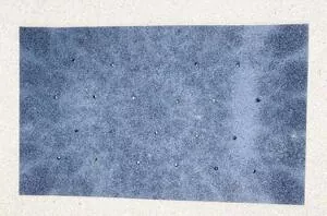 The brilliant reason this woman drills a bunch of holes in her bath mat
