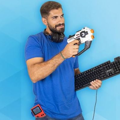 a man holding a computer keyboard and a controller
