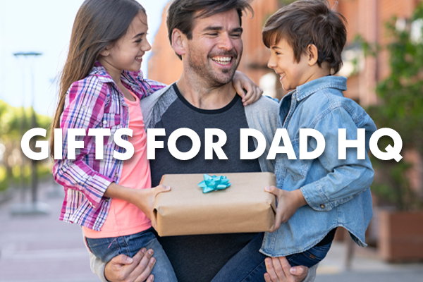 Image of dad and kids with a present