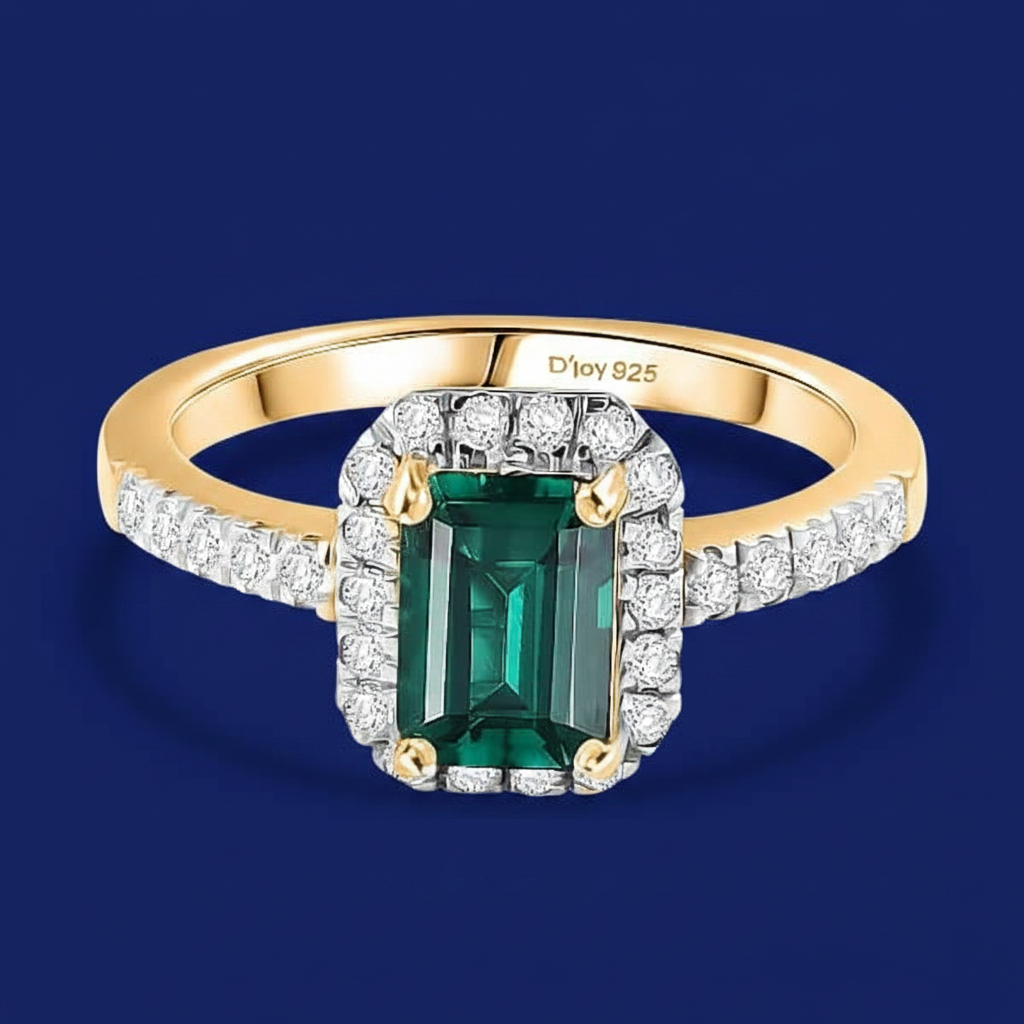 Gold ring with emerald and diamond halo, marked "D'joy 925".