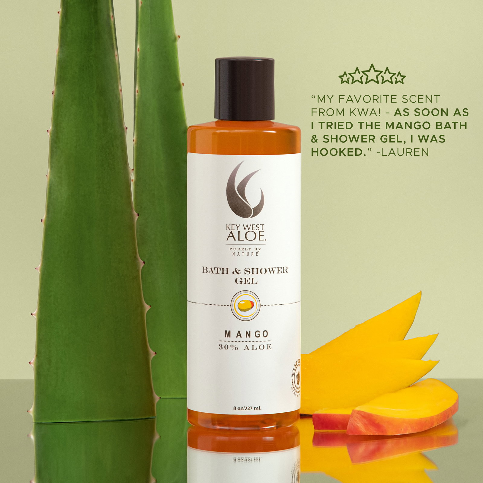 a bottle Mango Bath & Shower Gelnext to a plant