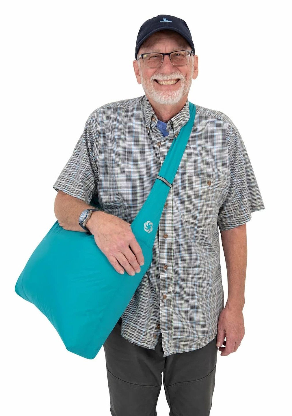 man smiling with blue grocery tote