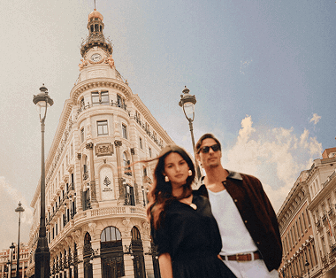 Couple in front of a historic building.