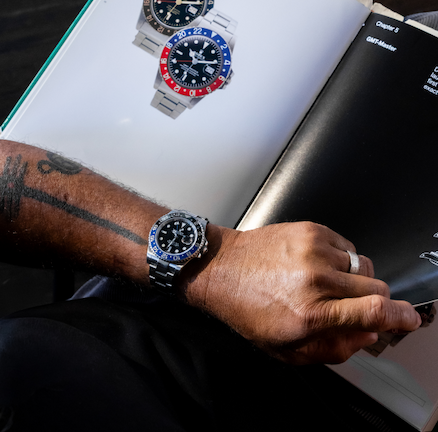 Person holding Rolex Certified Pre-Owned Watch