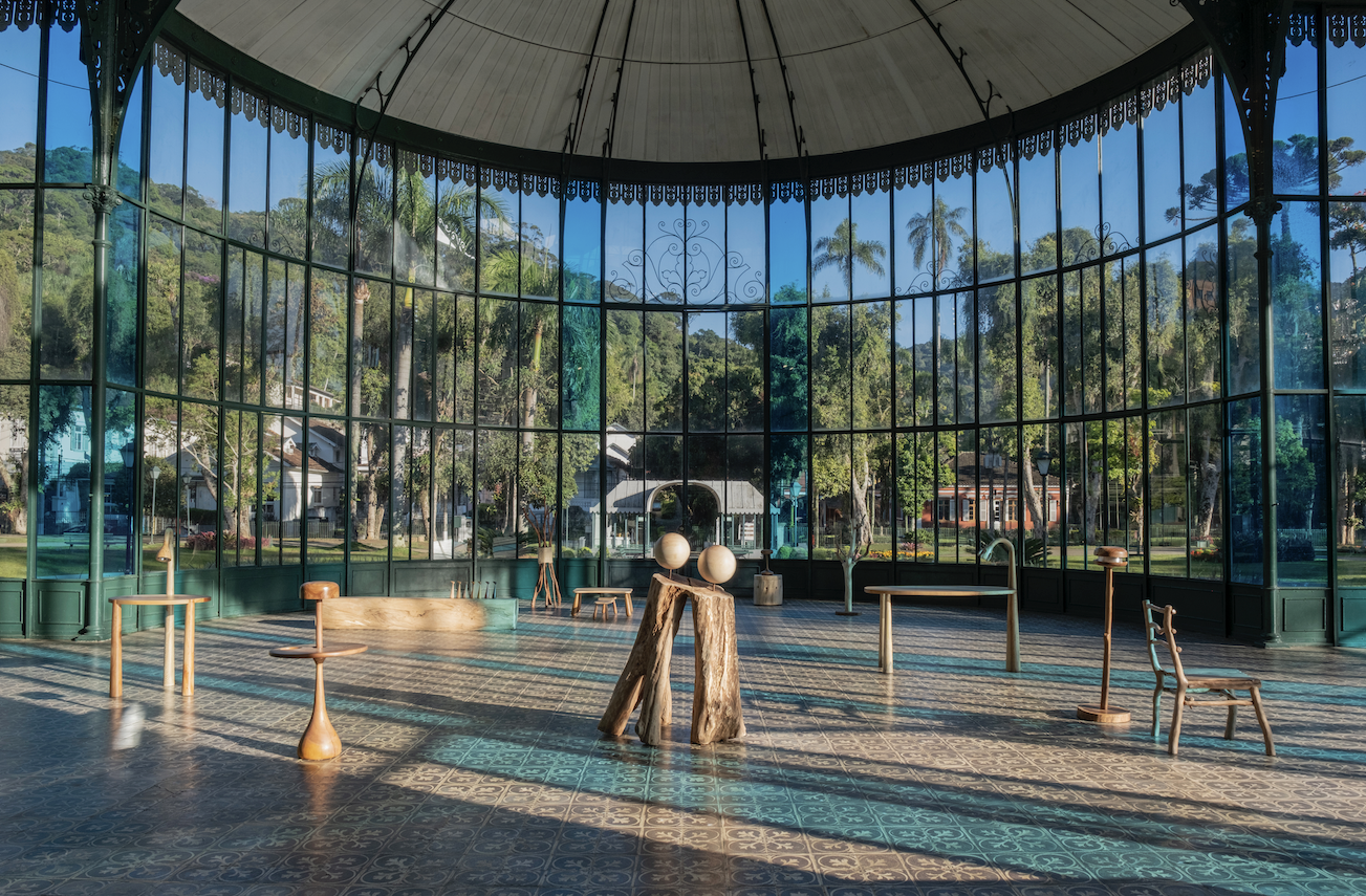 Wood furniture in glass-walled exhibition space