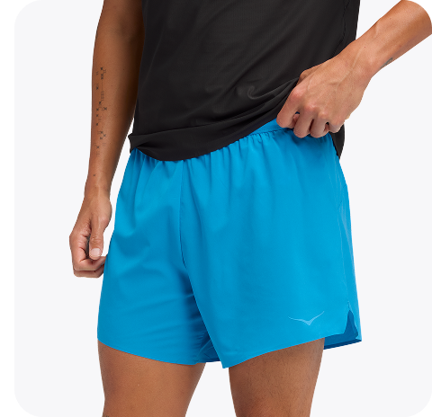 An image of a person from the front wearing the Airolite Short Sleeve, a HOKA run hat, a close up of a person zipping up the GlideTech Top, and a close up of a person wearing the Glide Shorts pulling their shirt up slightly.