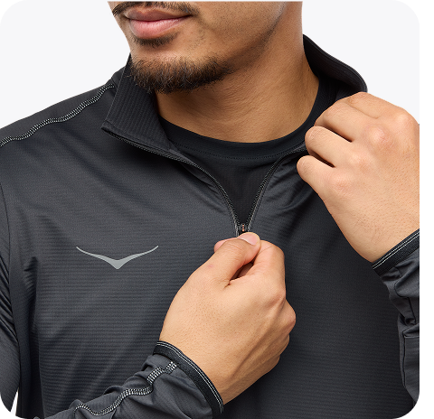 An image of a person from the front wearing the Airolite Short Sleeve, a HOKA run hat, a close up of a person zipping up the GlideTech Top, and a close up of a person wearing the Glide Shorts pulling their shirt up slightly.