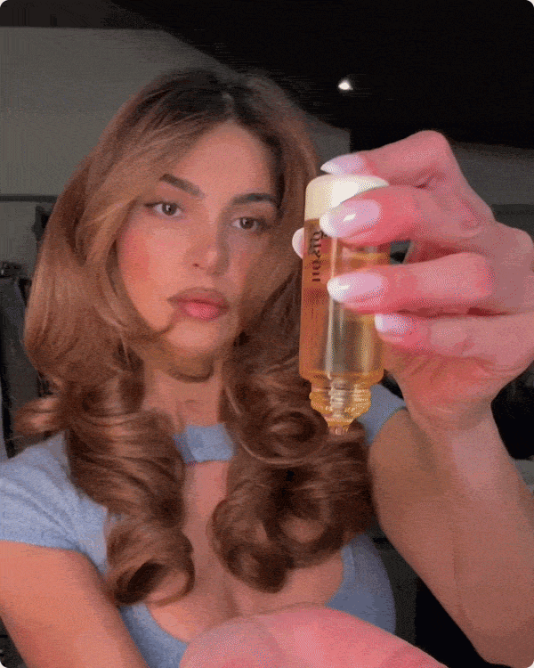 GIF of the NEW Honey Gloss Collagen Drops Hair Oil, showing packaging and Negin
