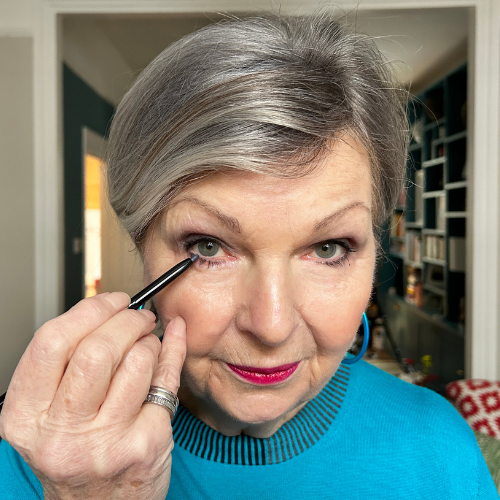 Apply eyeliner along your top and bottom lash line to finish your eye makeup with definition