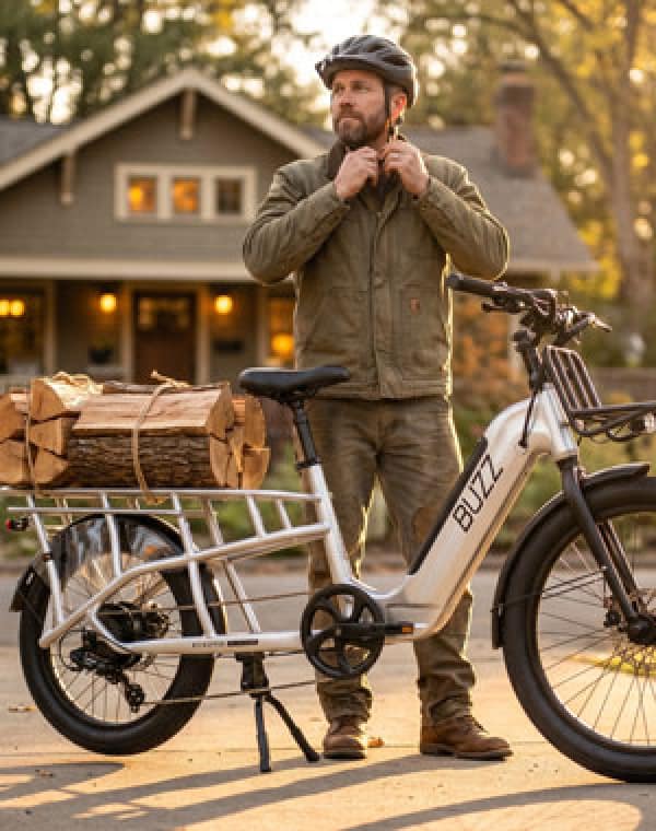 Man with bundles of wood on Beekeeper cargo ebike