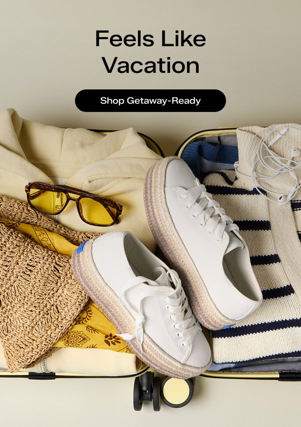 A light neutral background with an open suitcase filled with the Triple Up Canvas Ombre Jute Foxing Lace-Up in off white, a beige folded striped sweater and light yellow hoodie, yellow sunglasses, and accessories neatly arranged. The email says Feels Like Vacation. Shop Getaway-Ready.
