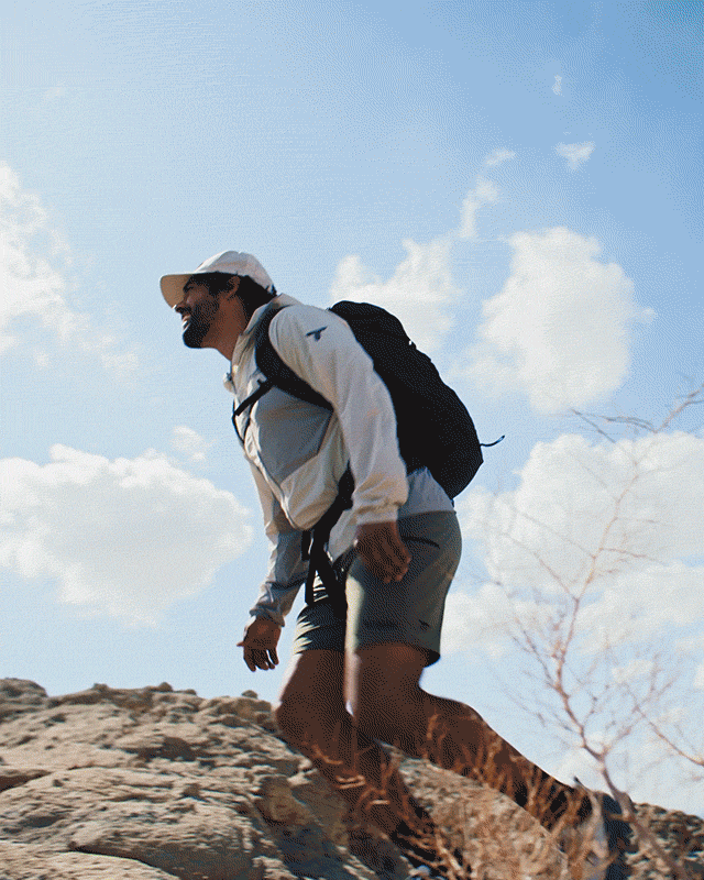Rotating images of a man and woman hiking in an arid wilderness.
