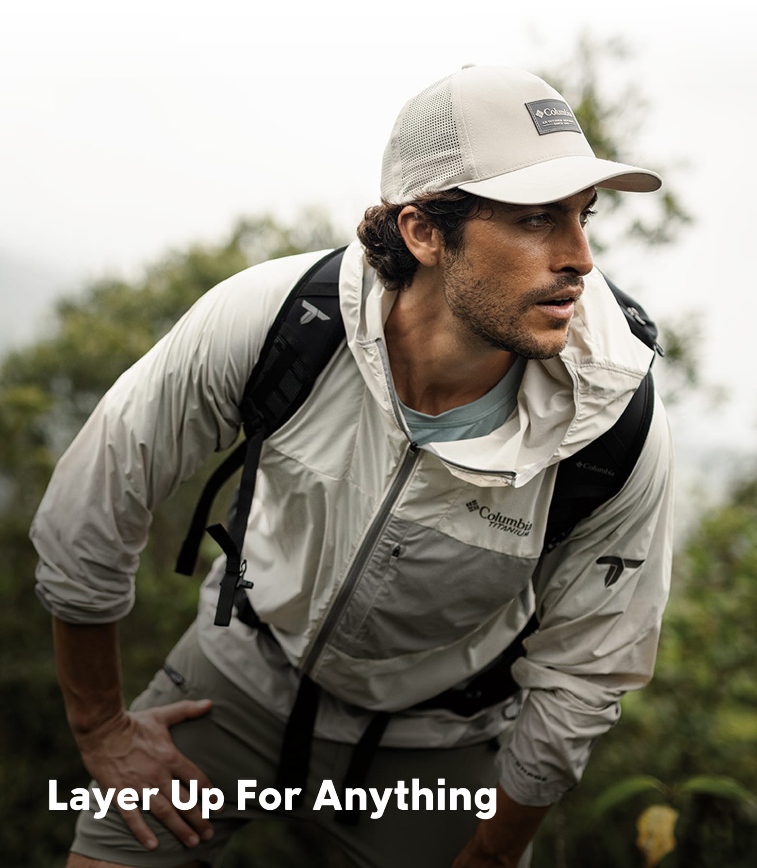 A man in Columbia gear hiking. Layer up for anything.