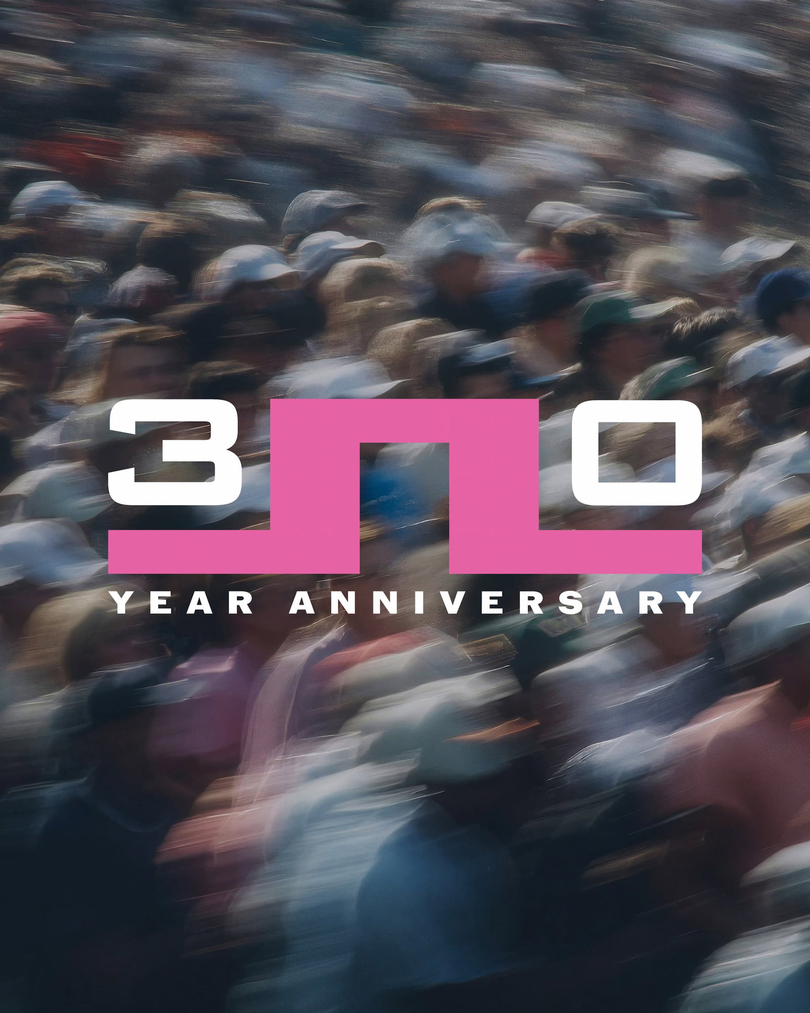 30 year anniversary graphic with exclusive logo against a backdrop of a blurred spectating crowd at a golf tournament