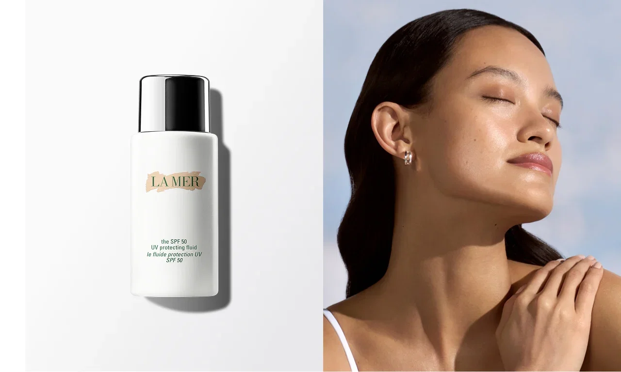 A bottle of The SPF 50 UV Protecting Fluid on a light grey background in the left section, and a close-up of a person with long dark hair and closed eyes, enjoying the sun, in the right section.