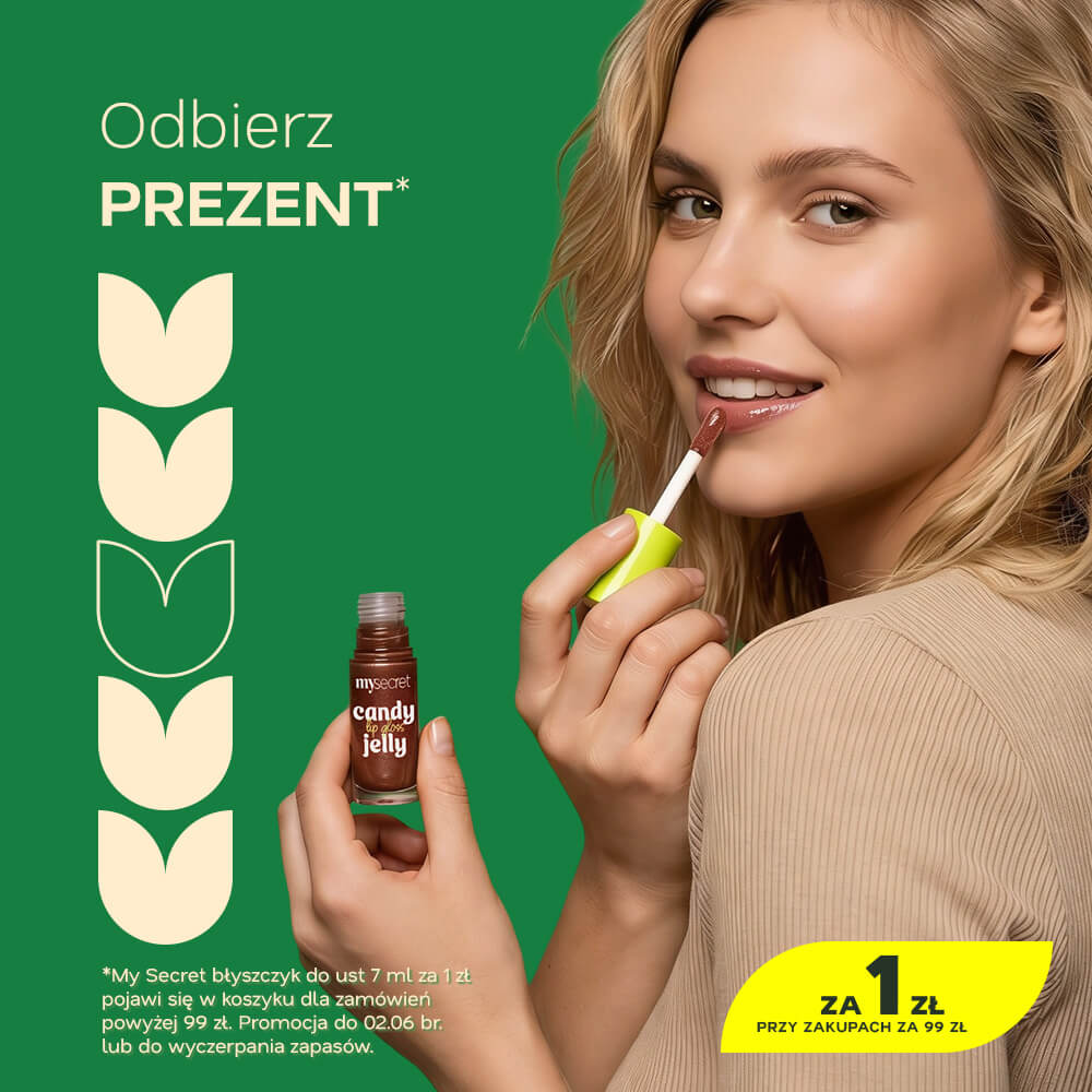 Close-up of a smiling woman applying brown lip gloss from a small bottle against a green promotional background