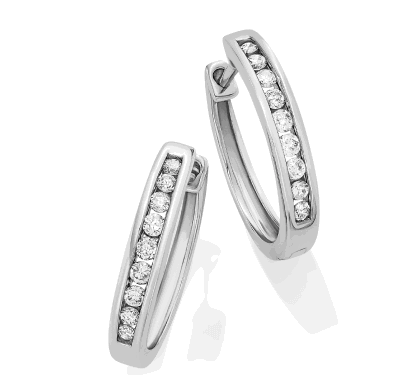 White gold diamond hoop earrings with pavé details.