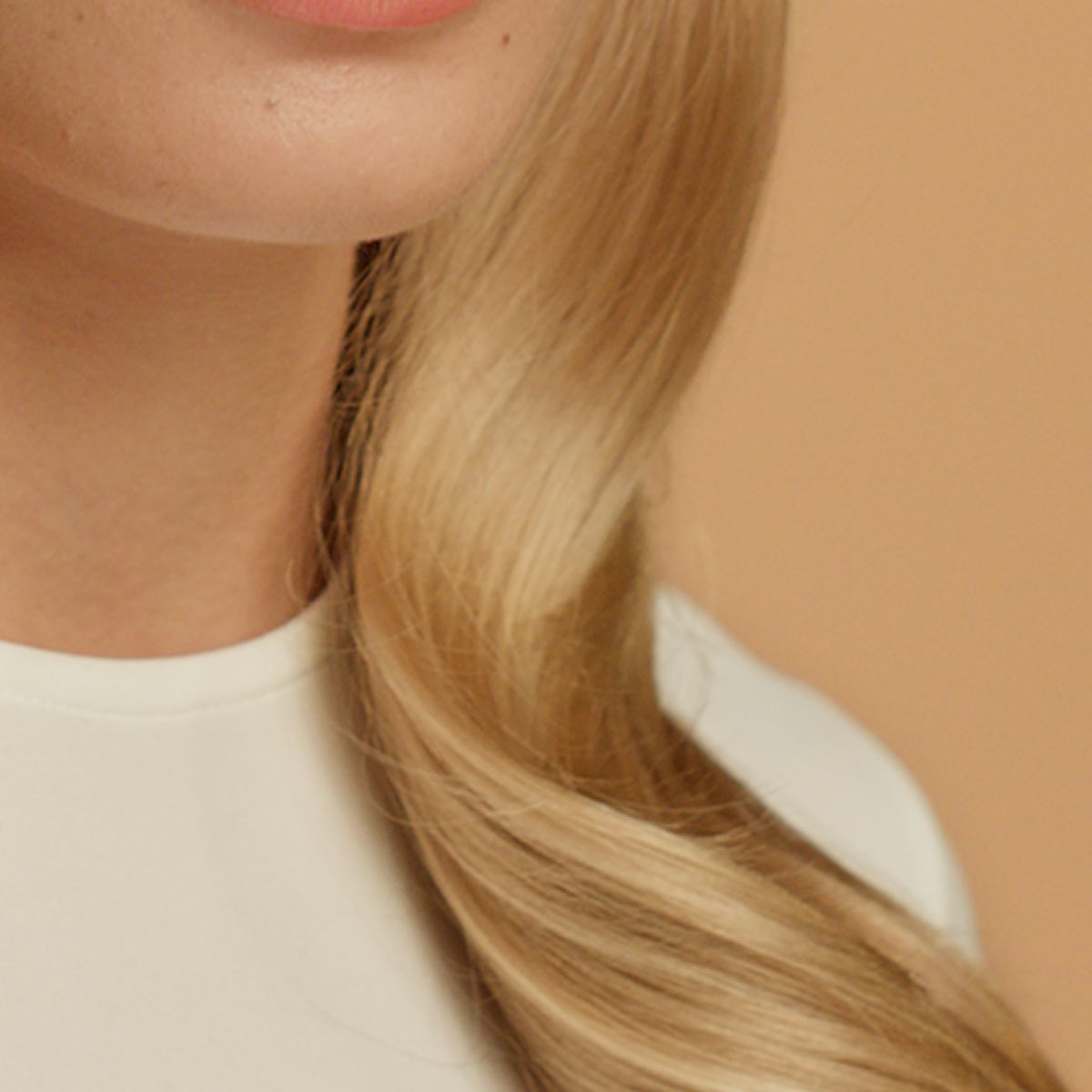 Close-up of straight blonde hair.