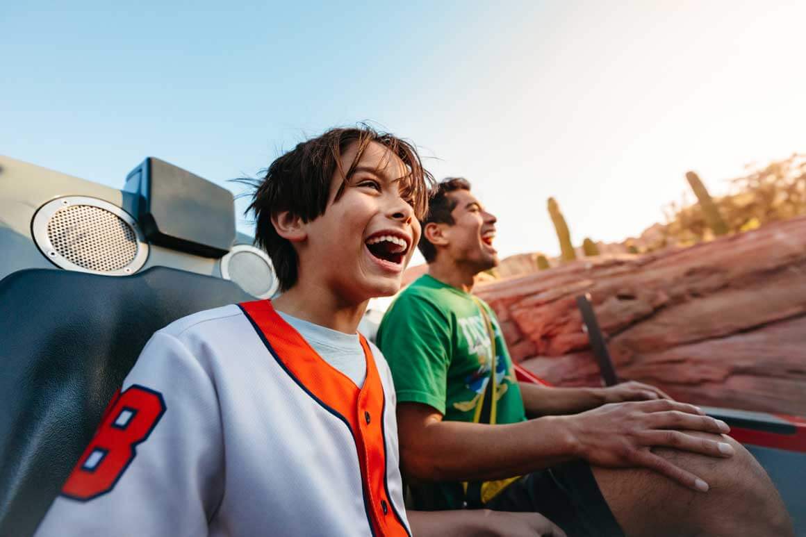 Father and Son on Radiator Springs Racers Car in Disneyland