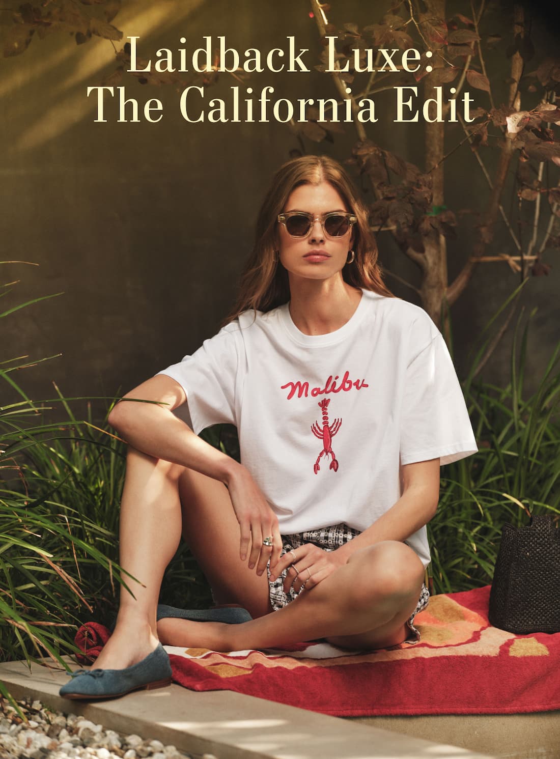 Laidback Luxe: The California Edit. Model sitting down wearing Sammy Tee.