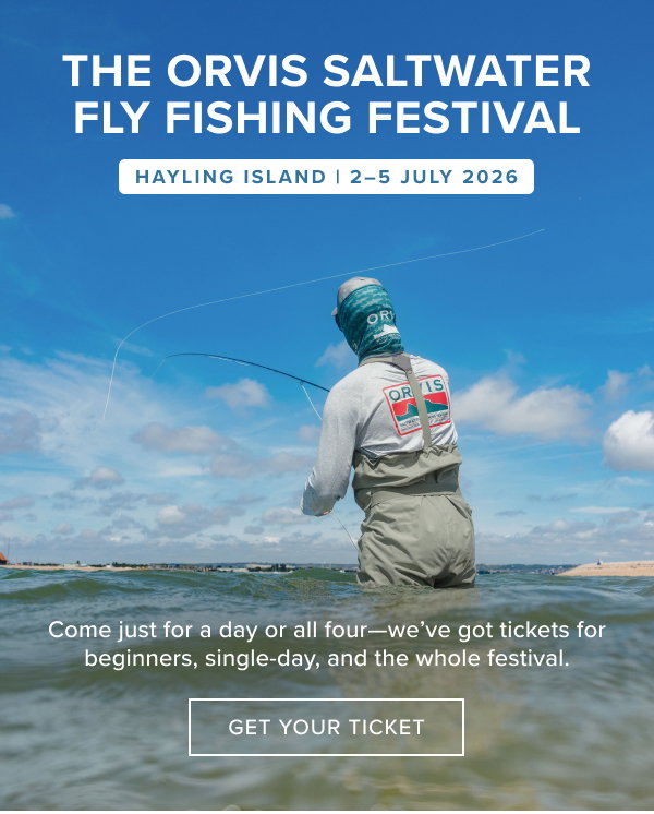 A man wearing waders stood in the ocean on a sunny day casting a fly rod at the Orvis Saltwater Fly Fishing Festival. Hayling Island 2nd to 5th July 2026. Get Your Ticket.