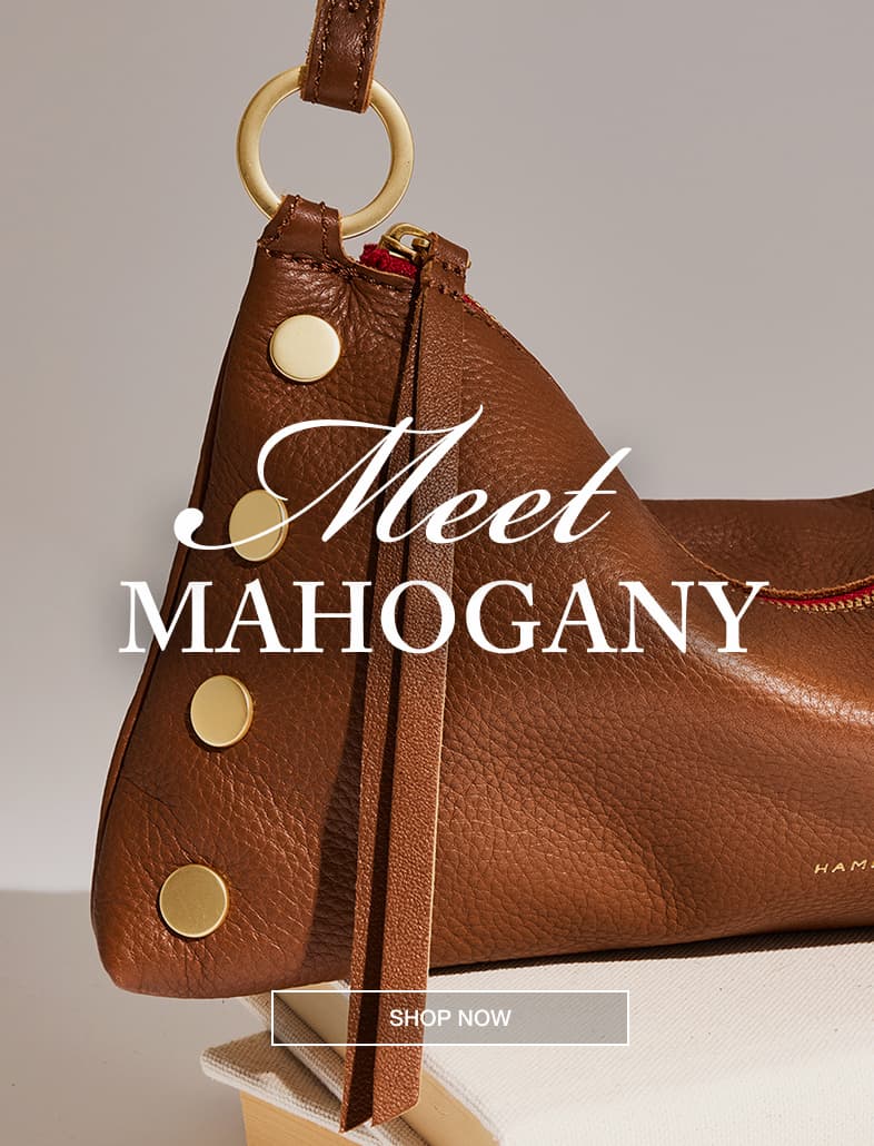 The Bestselling Kyle. CTA: Shop. Model in white top with Kyle sml in mahgany pebble brushed gold red zip on.