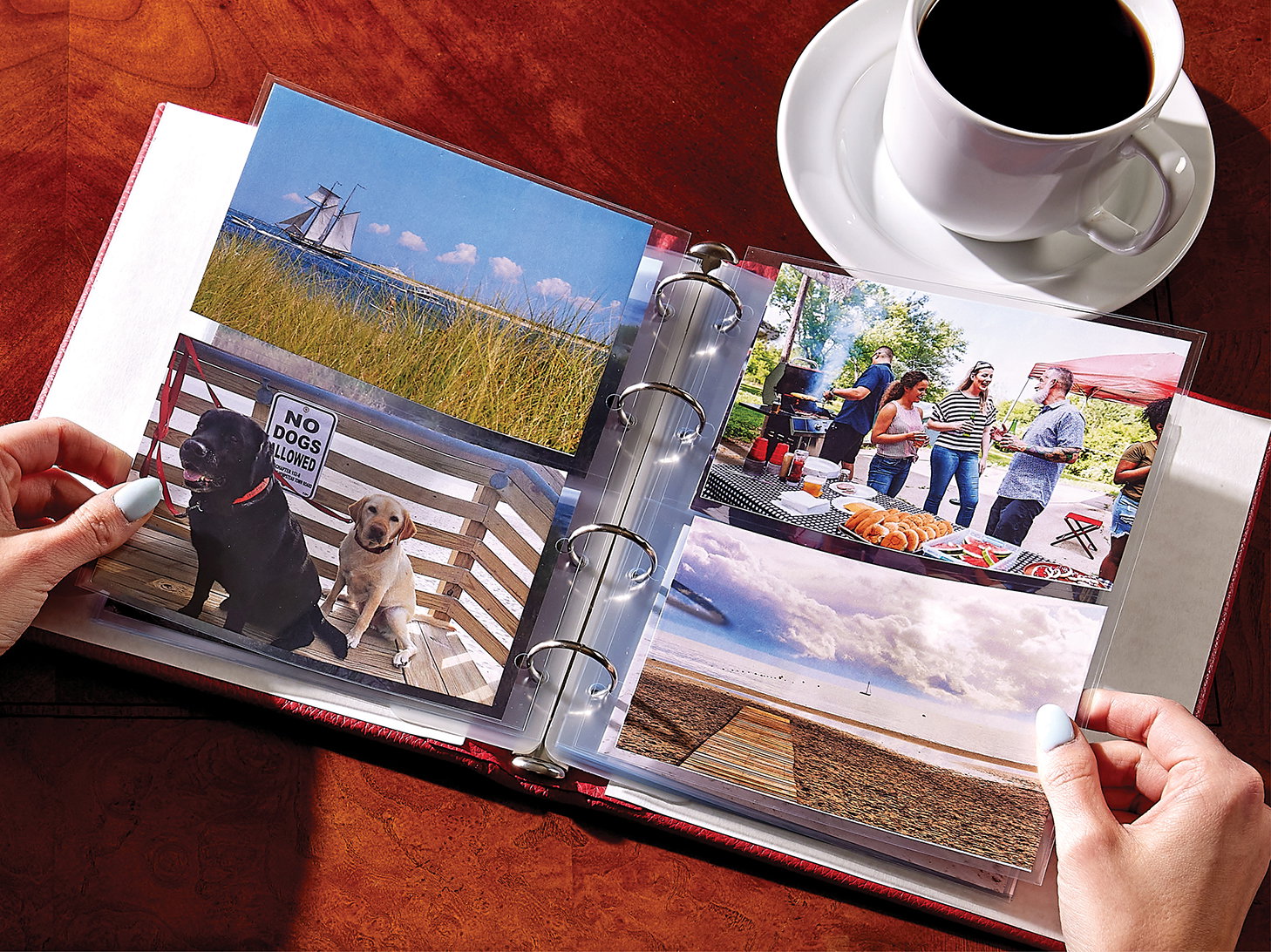 A clear pocket leather photo album full of summertime photos.