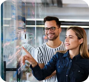 image-colleagues-reviewing-information-on-a-glassboard
