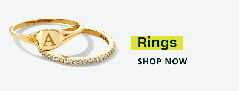 A gold signet ring with an engraved 'A' & thin band encrusted with stones. Rings. Click here to shop now