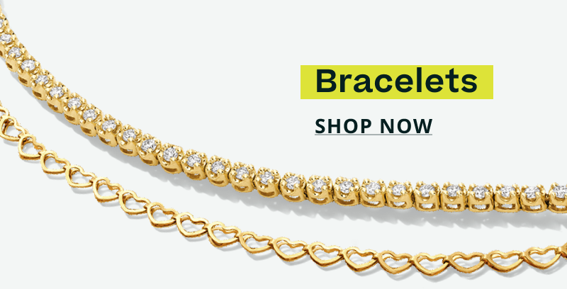 Two layered gold bracelets: tennis-style & chain composed of small interlocking hearts. Bracelets. Click here to shop now