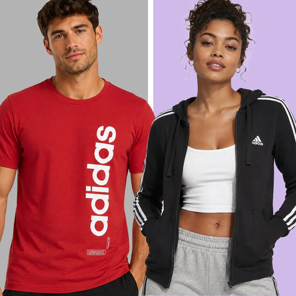 Two people modeling adidas sportswear: man in red logo tee, woman in black zip hoodie with white crop top and gray shorts.