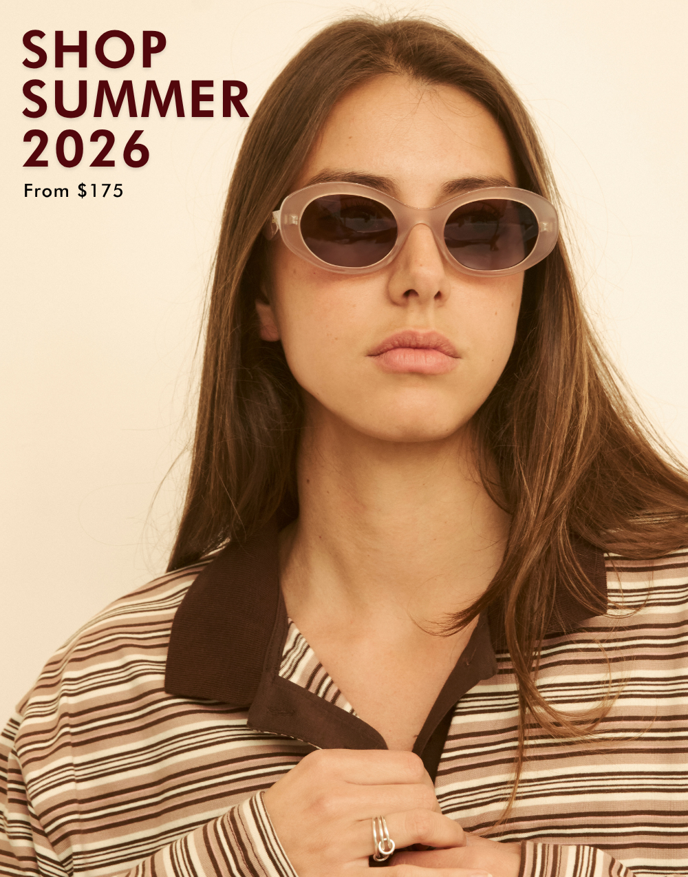 A promotional headshot of a woman wearing a brown and cream striped polo shirt and translucent clear oval sunglasses with dark lenses. Bold maroon text in the upper-left corner reads 