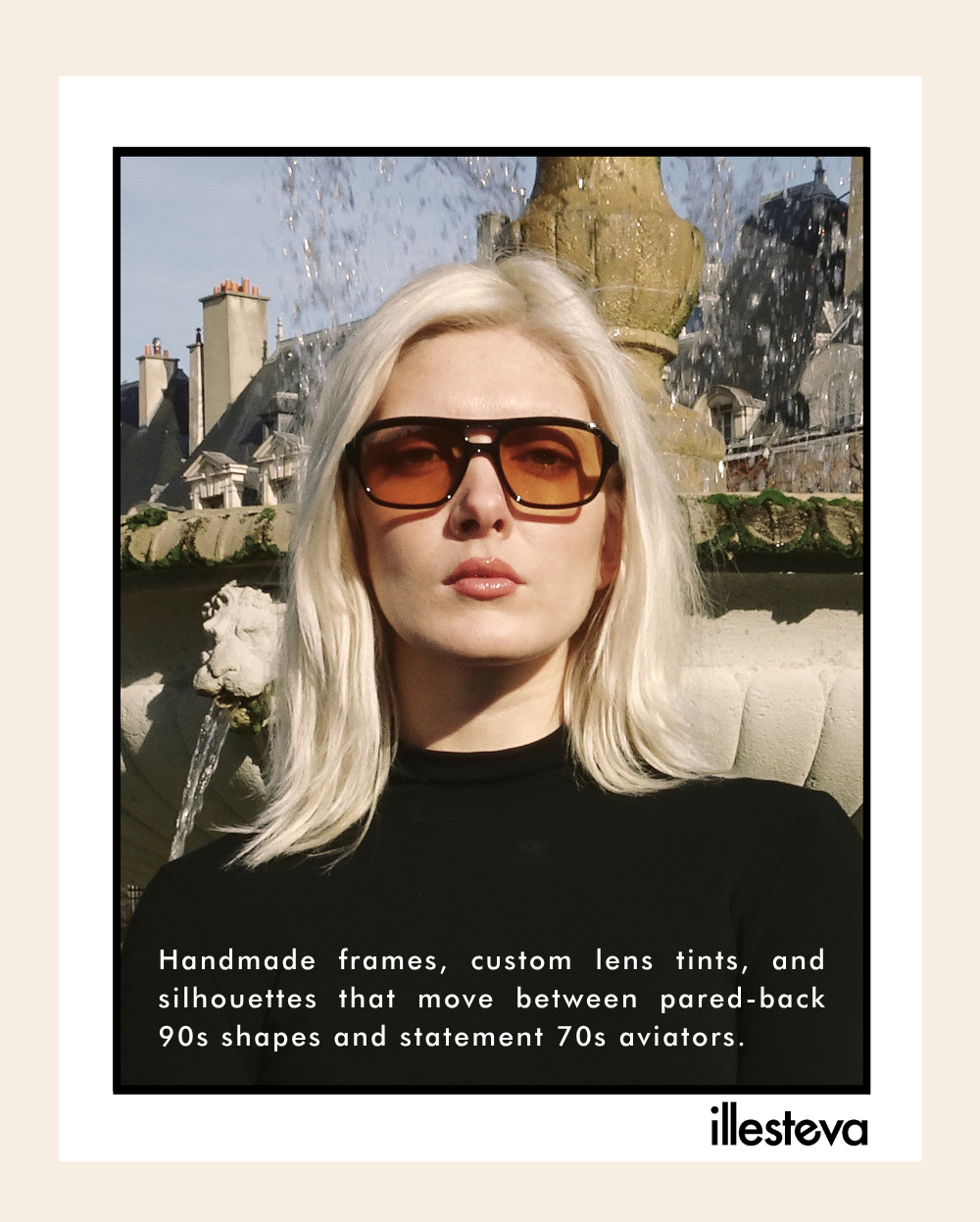 A framed campaign photograph of a platinum blonde woman standing in front of a stone fountain while wearing black aviator sunglasses with orange lenses. Text overlaying the bottom of the photo describes the handmade frames moving between 90s shapes and 70s aviators, with the illesteva logo in the lower-right corner.