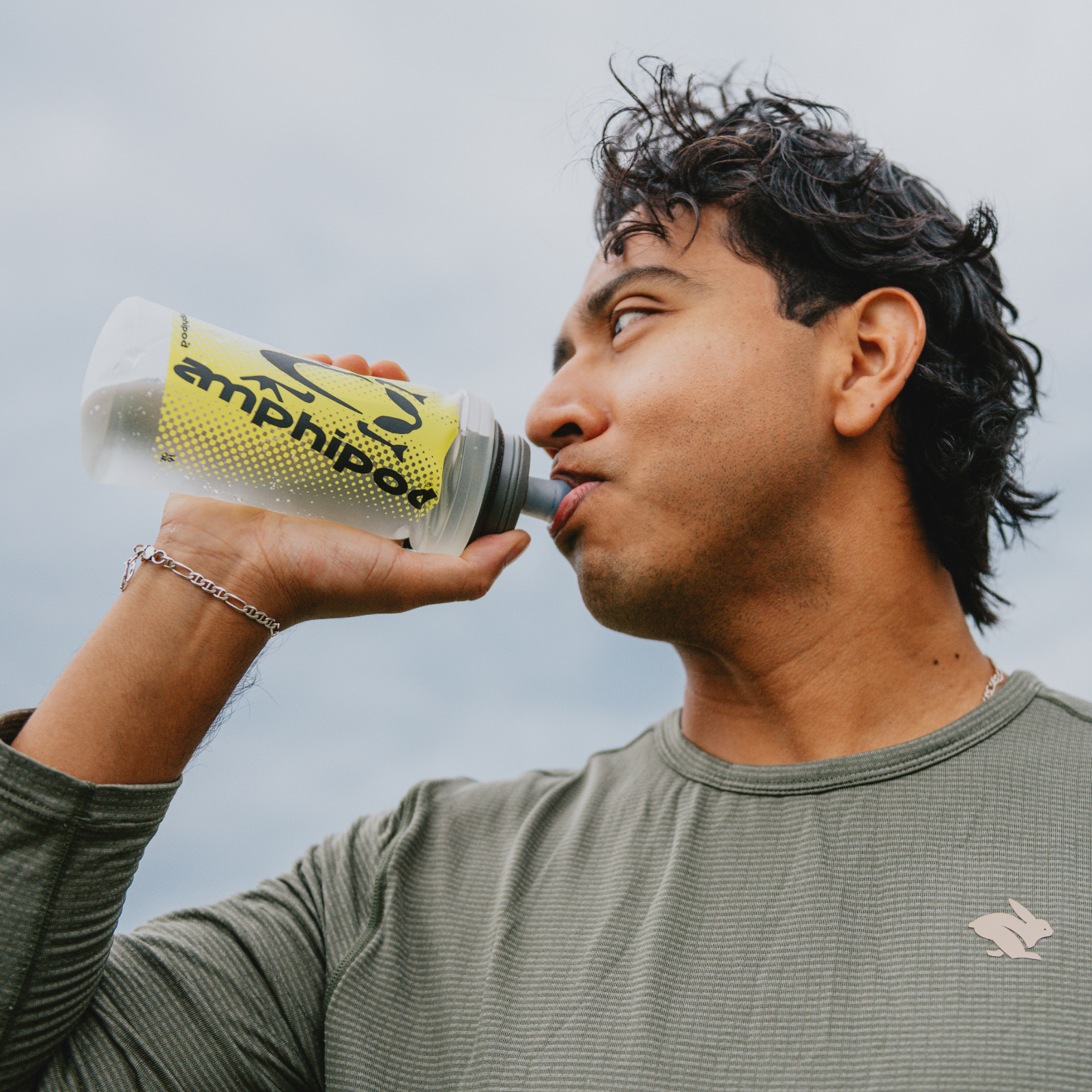 Runner drinking from a handheld waterbottle