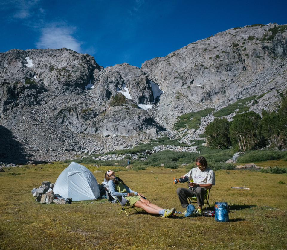 Emi and partner at campsite.