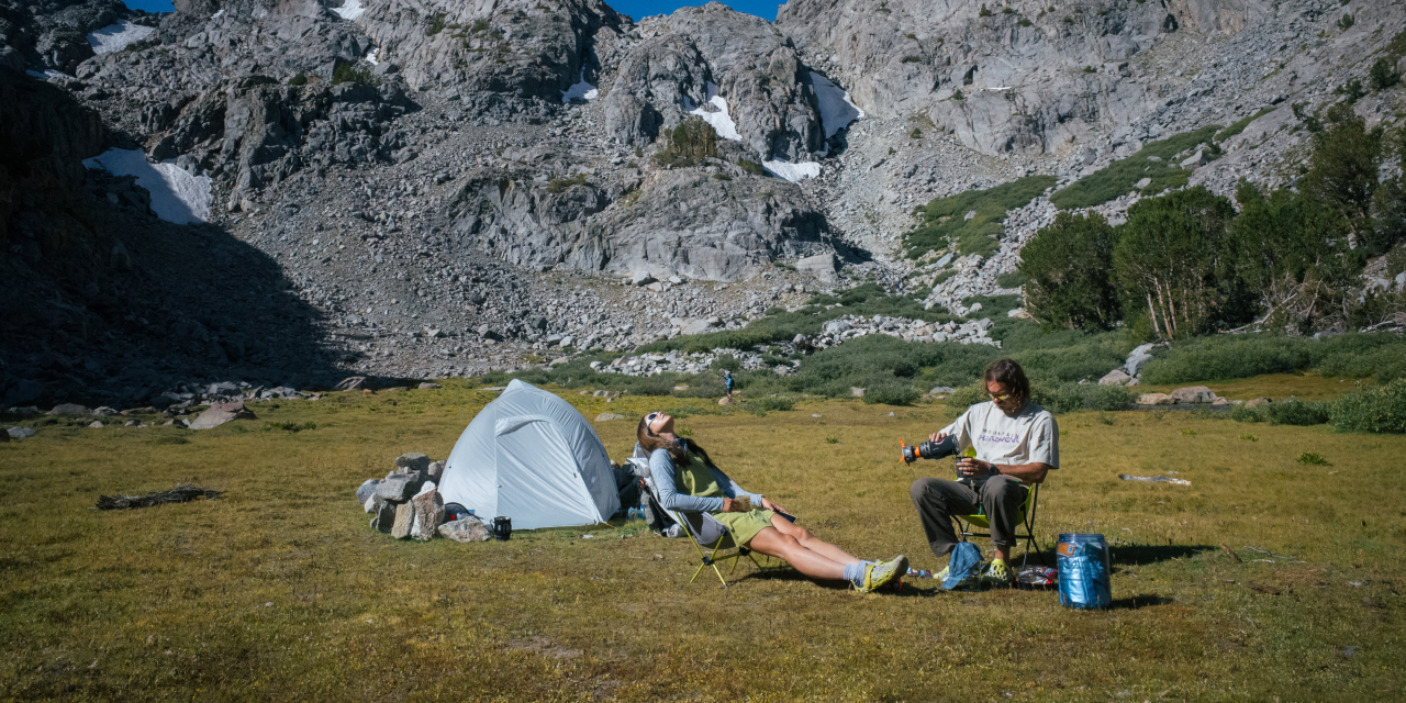 Emi and partner at campsite.