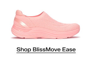 A side view of the BlissMove Knit Ease Slip-On in neon coral. Shop Now.