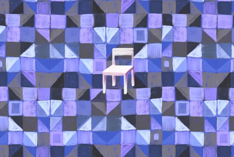 A chair in the middle of a patterned background | Jorm Sangsorn/Getty Images