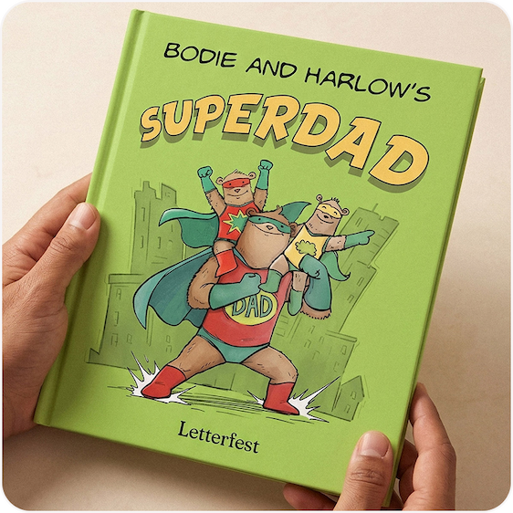 A pair of hands holding a personalised Superdad book with an illustrated bear superhero on the cover