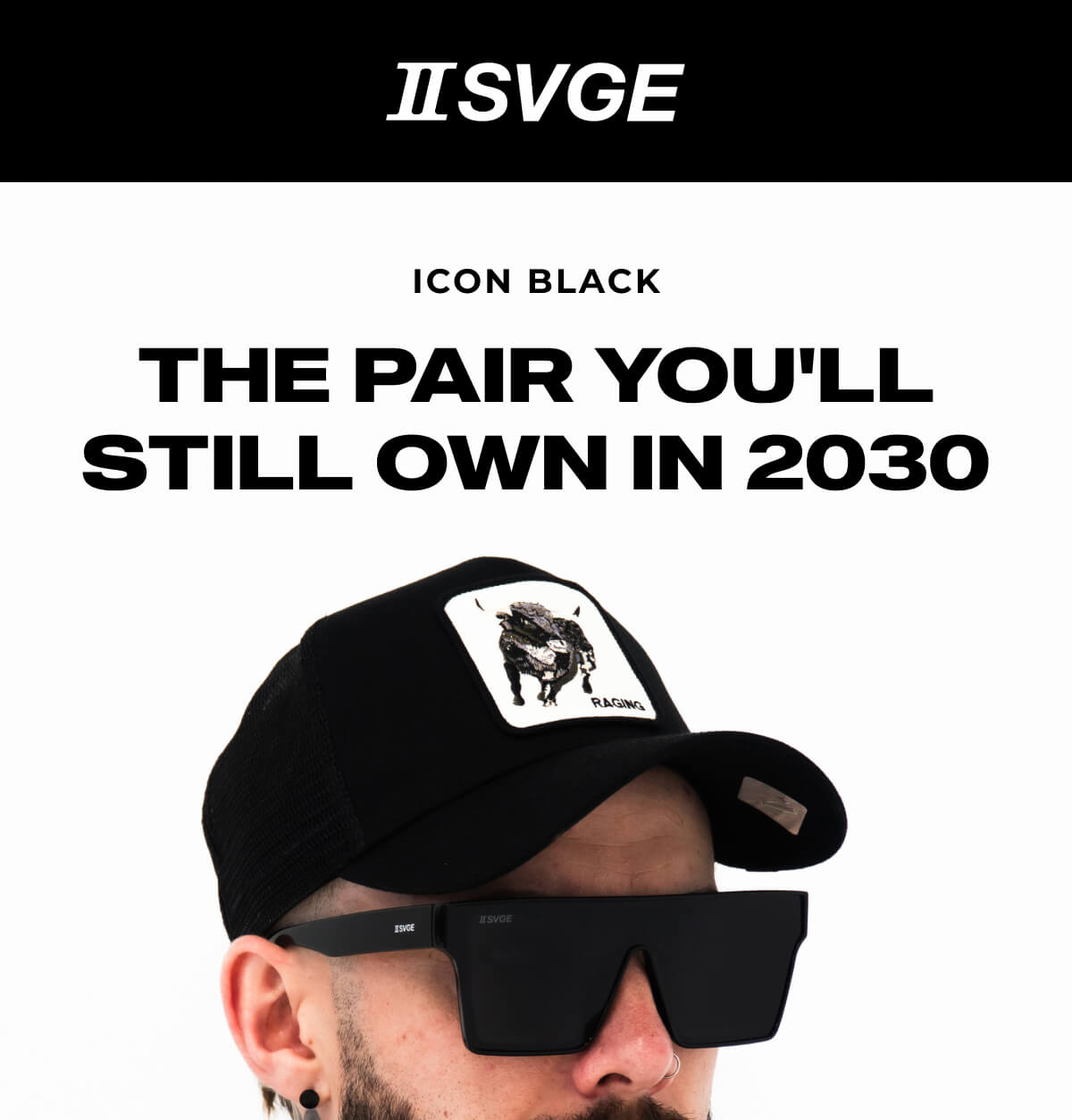 Person wearing oversized black sunglasses and a black cap against a light background, with text describing the Icon Black sunglasses style.