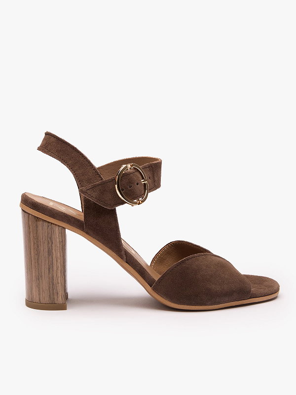 Brown suede high-heeled sandal with a wooden block heel and gold buckle strap.