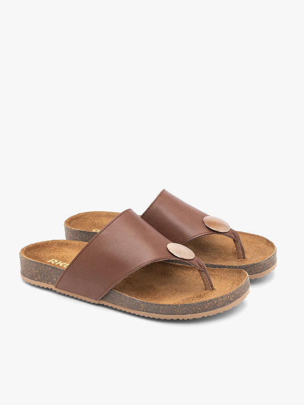 Brown leather sandals with cork soles on a white background