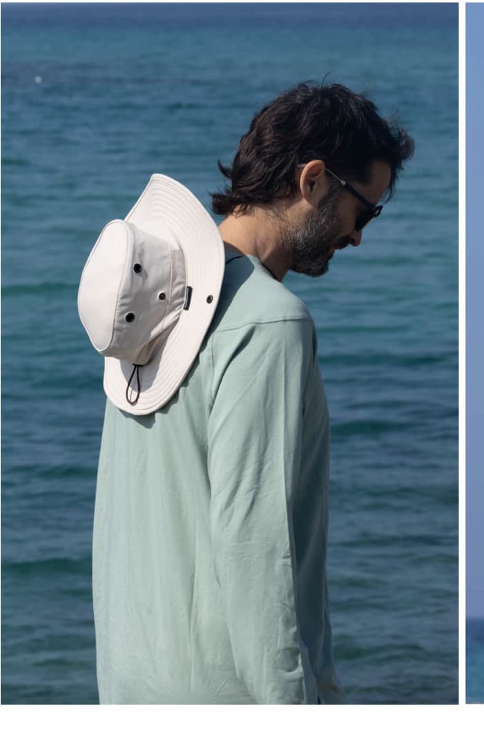 Man Wearing UPF 20+ Bamboo Sun Shirt in Sage and Trek All-Weather Hat in Bone/Chocolate