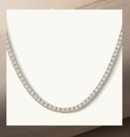 A silver diamond tennis necklace.