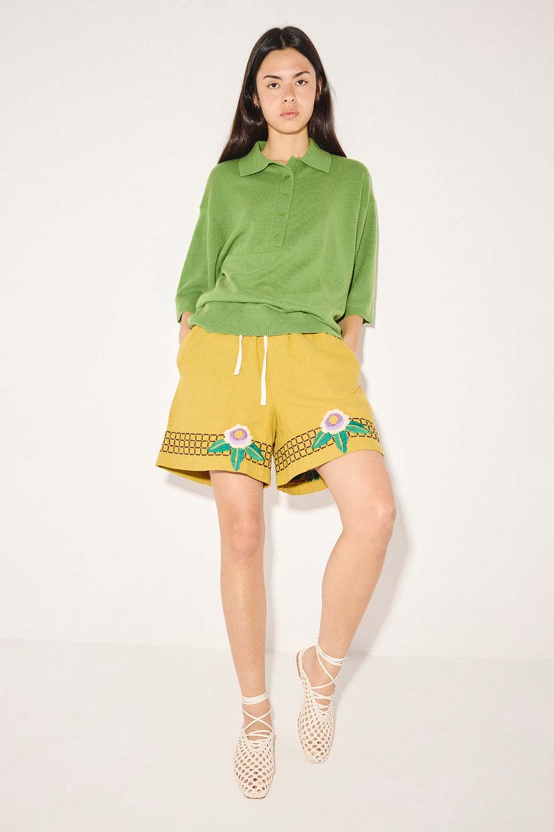ETTA woven ankle lace up flat in vanilla styled with yellow embroidered shorts and terry polo in green